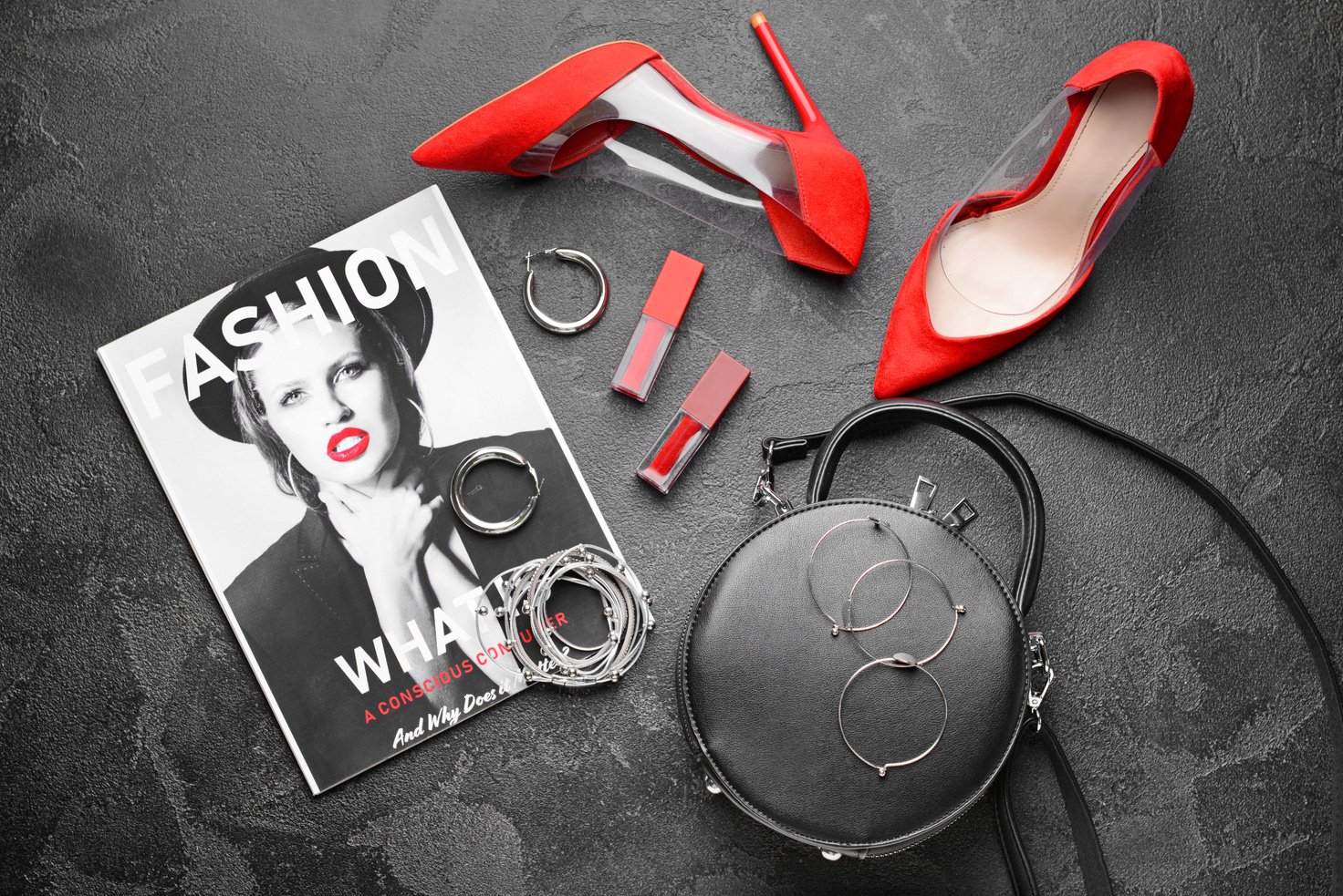 Fashion Magazine with Decorative Cosmetics and Female Accessories on Dark Background